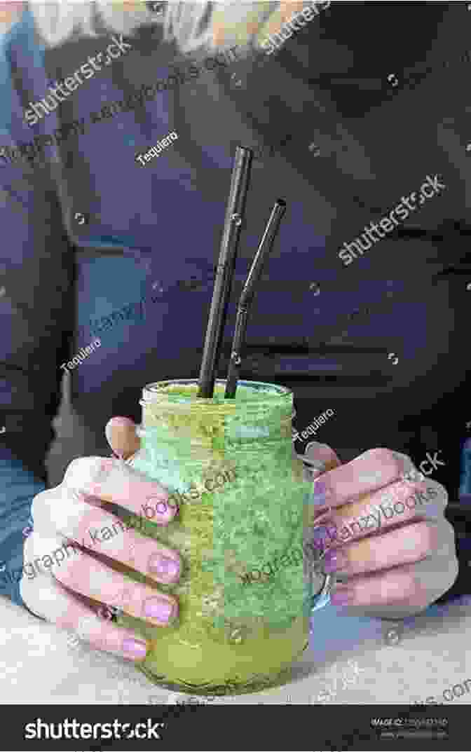 Person Holding A Green Smoothie While Exercising Smoothies Recipes: The Ultimate Guide To Making Delectable Smoothies At Home In Less Than 15 Minutes